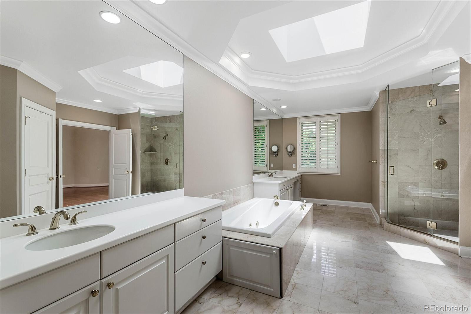 470 Monroe Street Denver, CO 80206 - Photo 28 of 40 a bathroom with a double vanity sink mirror and shower