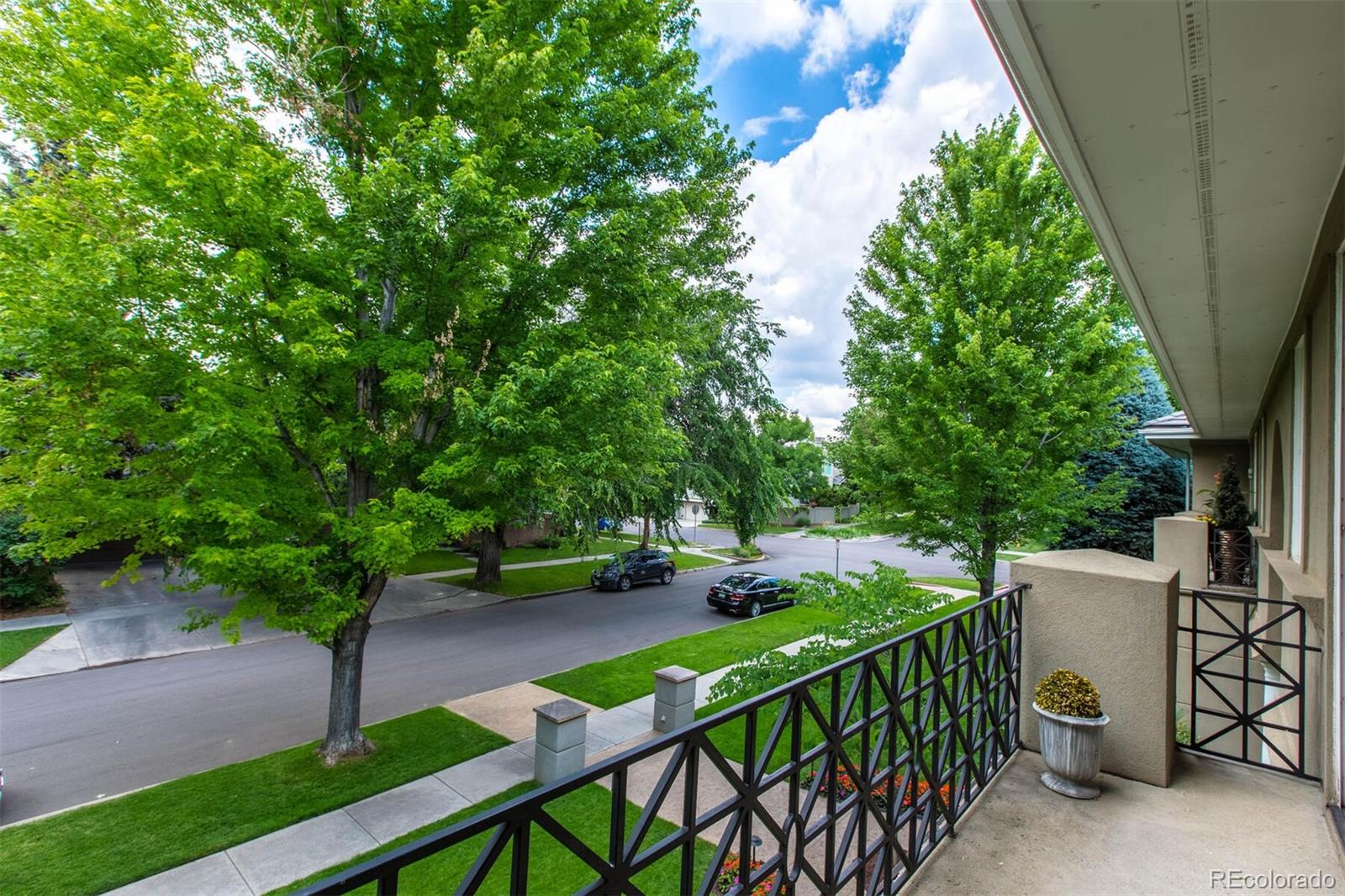 470 Monroe Street Denver, CO 80206 - Photo 29 of 40 a view of a patio with table and chairs with wooden fence and plants