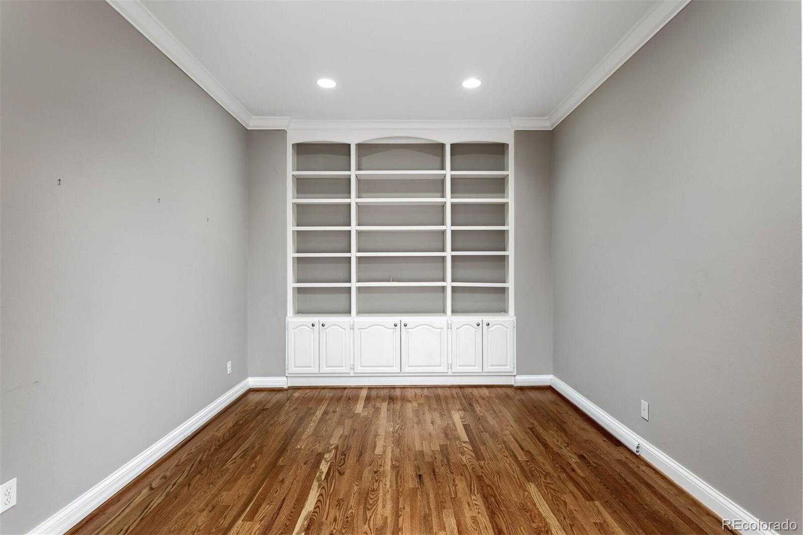 470 Monroe Street Denver, CO 80206 - Photo 30 of 40 a view of empty room with wooden floor and fan
