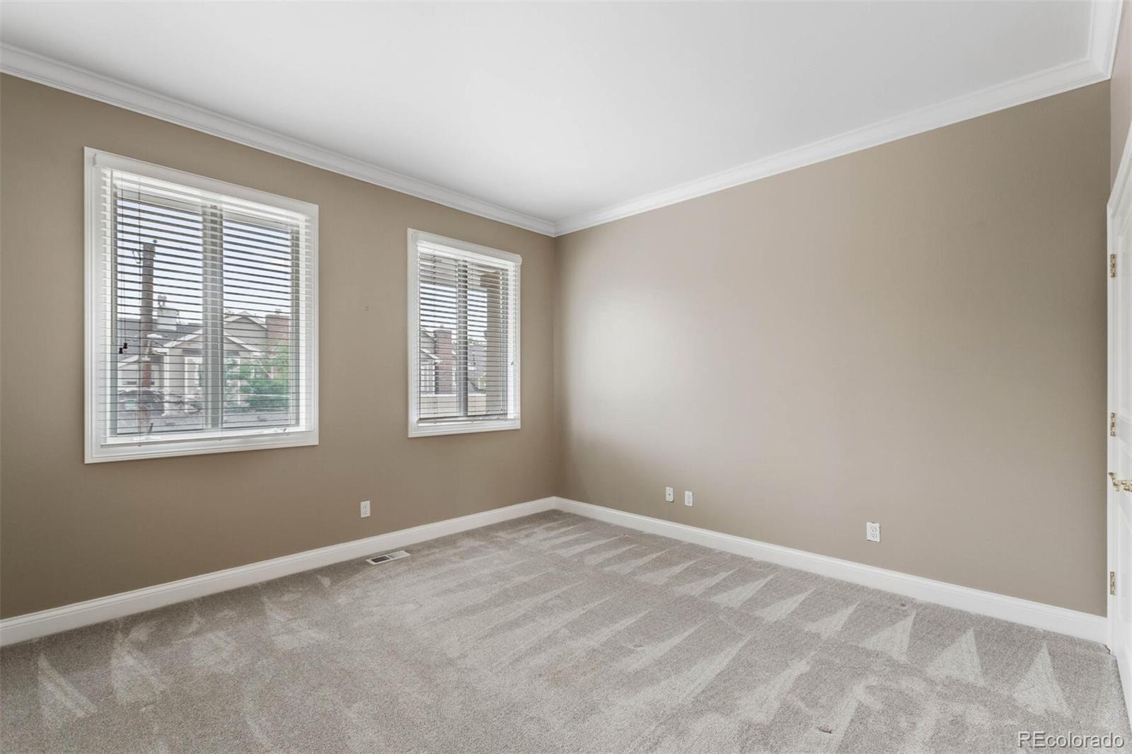 470 Monroe Street Denver, CO 80206 - Photo 31 of 40 an empty room with windows