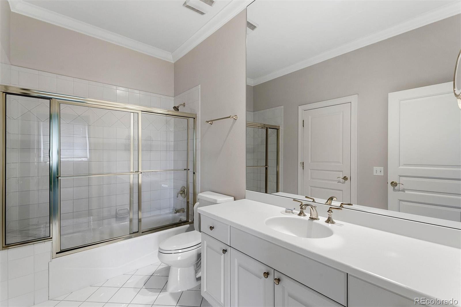 470 Monroe Street Denver, CO 80206 - Photo 32 of 40 a bathroom with a sink toilet and shower