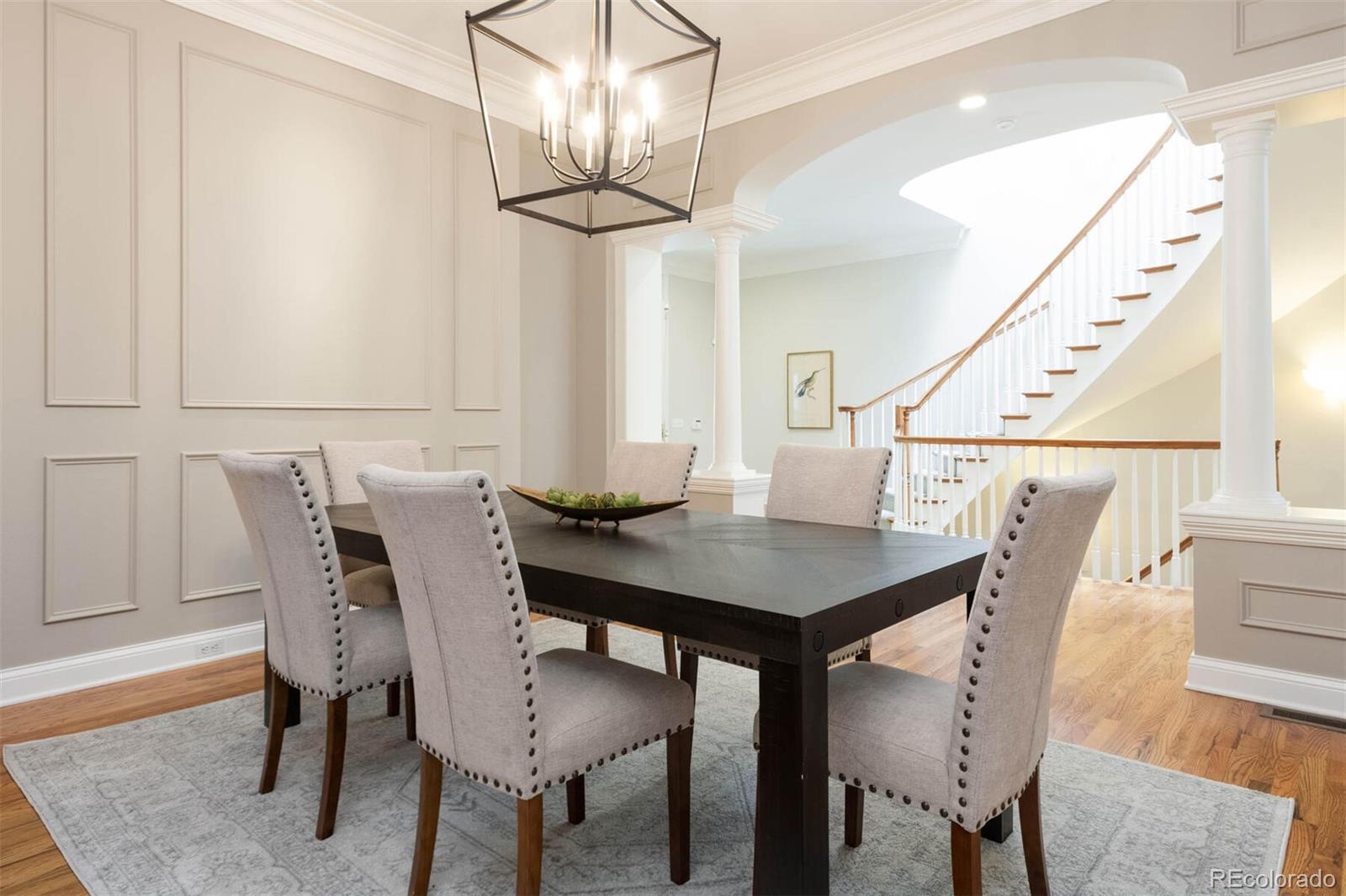 470 Monroe Street Denver, CO 80206 - Photo 7 of 40 a view of a dining room with furniture and wooden floor