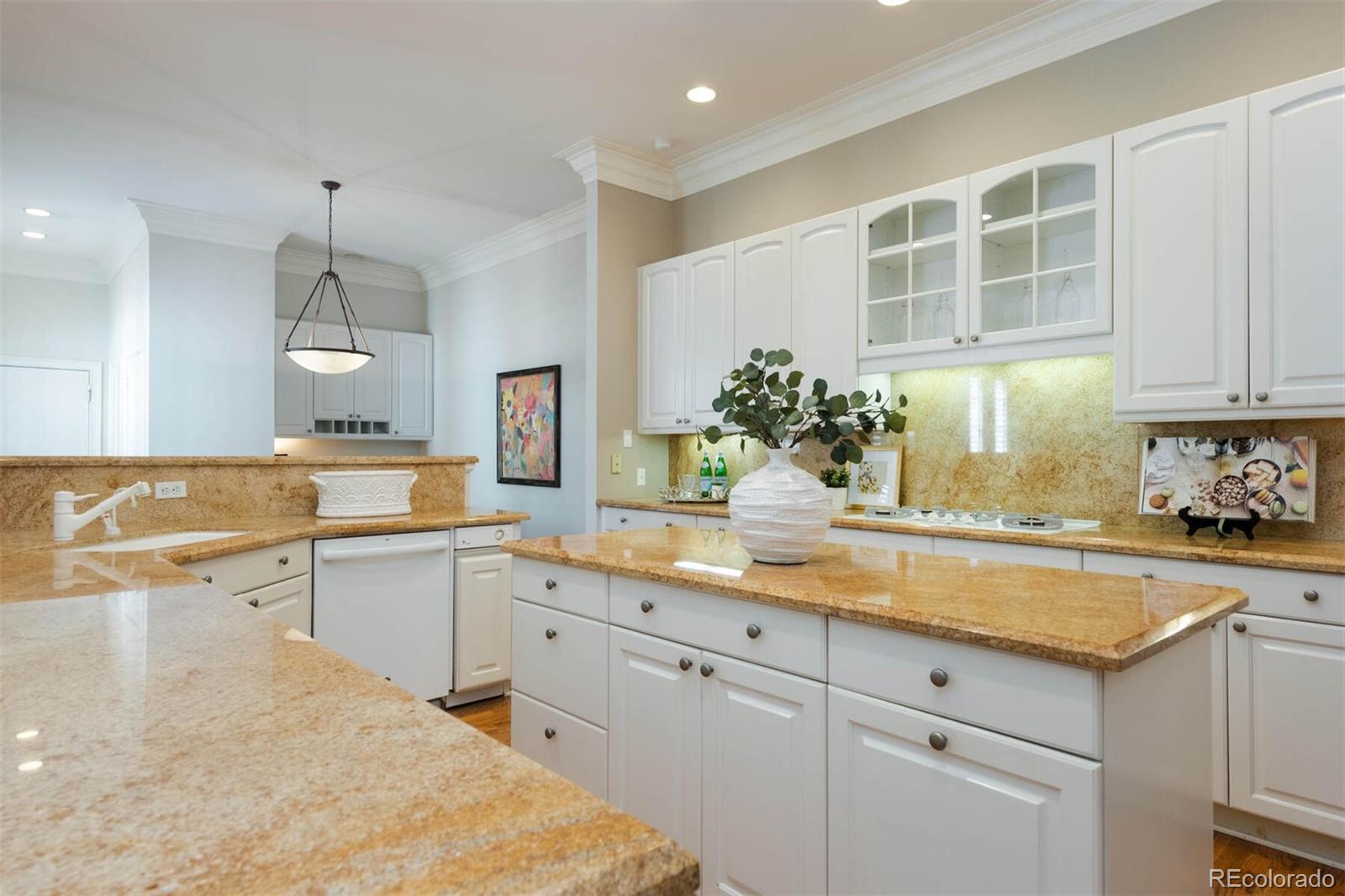 470 Monroe Street Denver, CO 80206 - Photo 10 of 40 a kitchen with a sink stove and cabinets