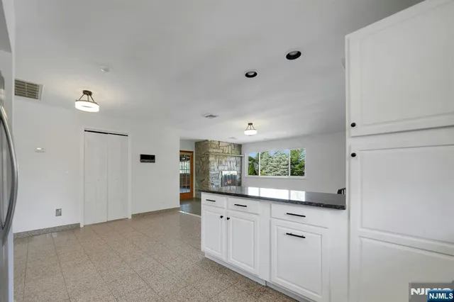 a large bathroom with a double vanity sink and mirror