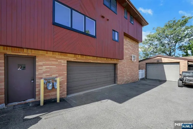 a front view of a house with garage