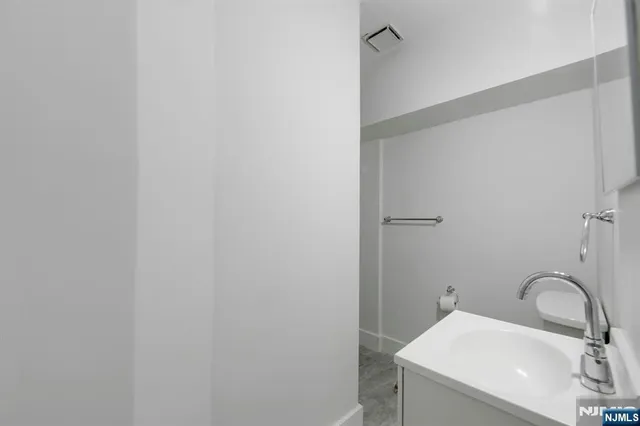 a bathroom with a sink and mirror