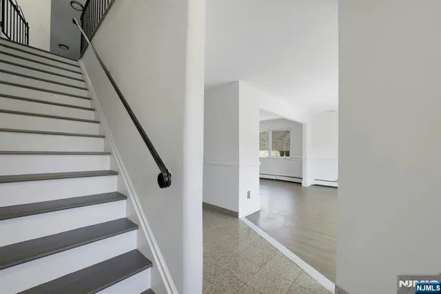 a view of a hallway with staircase