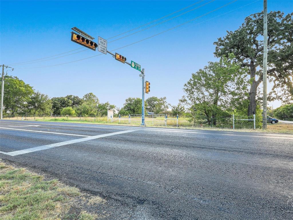 7801 Fishtrap Road Cross Roads, TX 76227 - Photo 4 of 4 a view of a road with a house in the background