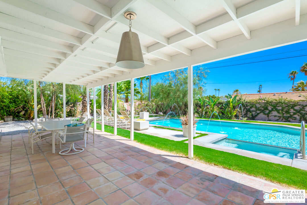 2405 East Francis Drive Palm Springs, CA 92262 - Photo 14 of 17 a view of a porch with furniture and garden