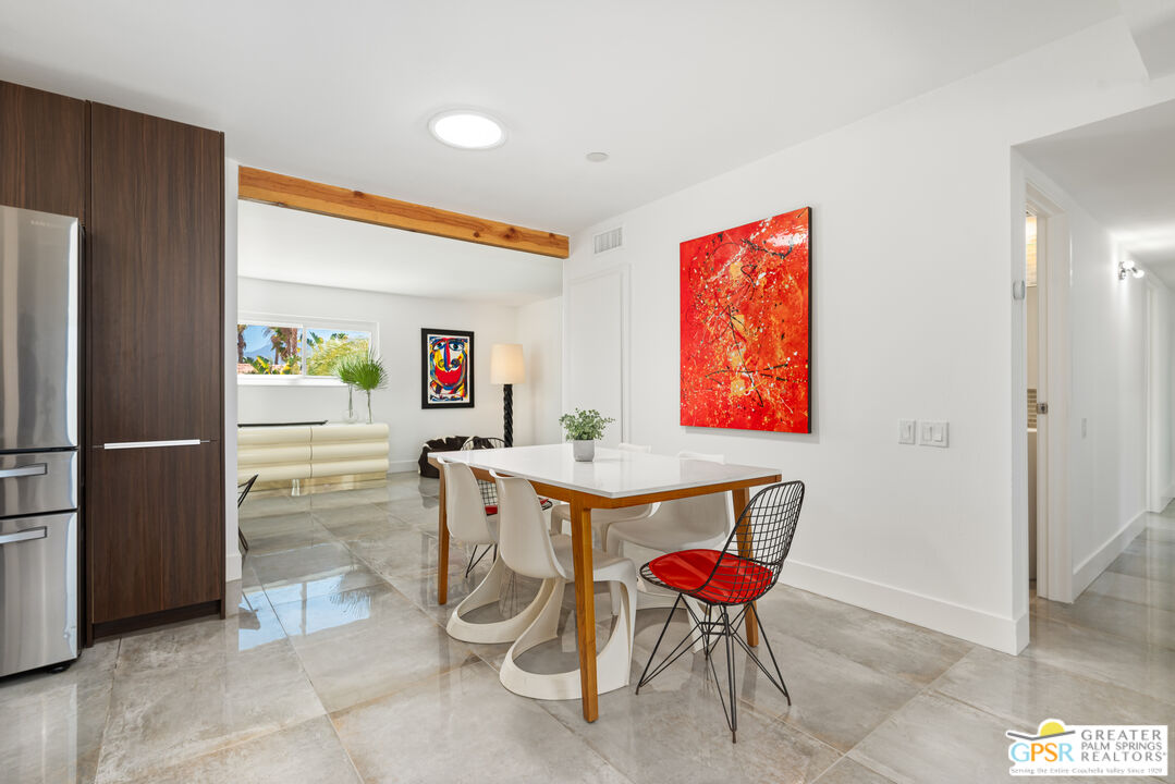 2405 East Francis Drive Palm Springs, CA 92262 - Photo 7 of 17 a room with a table and chairs