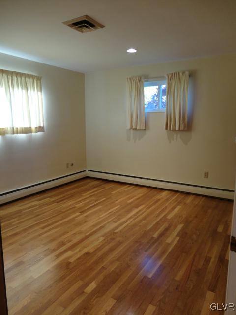 1230 Clearfield Road Nazareth, PA 18064 - Photo 16 of 20 a view of an empty room with window and wooden floor