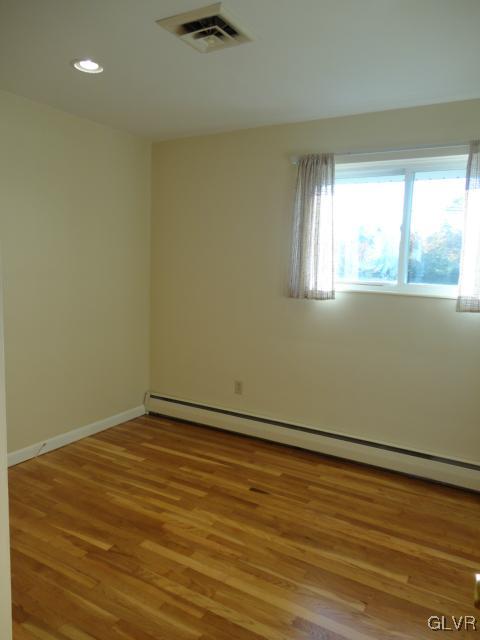 1230 Clearfield Road Nazareth, PA 18064 - Photo 18 of 20 an empty room with wooden floor and windows