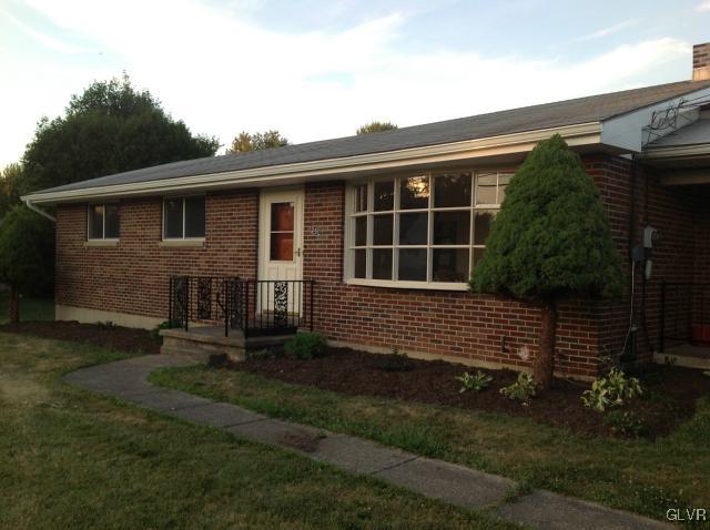 1230 Clearfield Road Nazareth, PA 18064 - Photo 4 of 20 a front view of a house with a garden