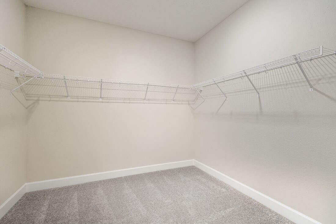 86654 Swift Launch Path Yulee, FL 32097 - Photo 15 of 31 a view of a room with racks on the wall