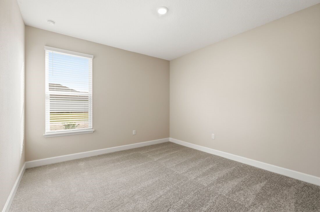86654 Swift Launch Path Yulee, FL 32097 - Photo 17 of 31 a view of an empty room with a window