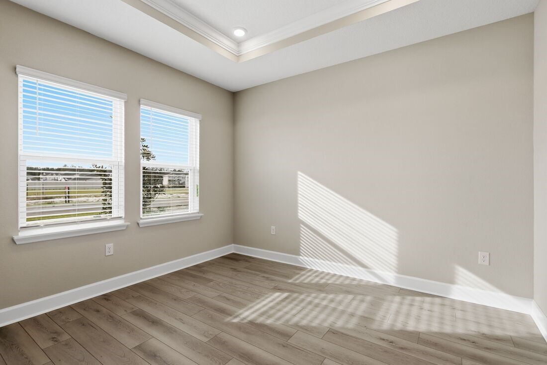 86654 Swift Launch Path Yulee, FL 32097 - Photo 21 of 31 a view of an empty room with wooden floor and a window