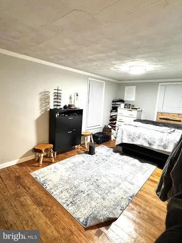 a bedroom with furniture and a bed