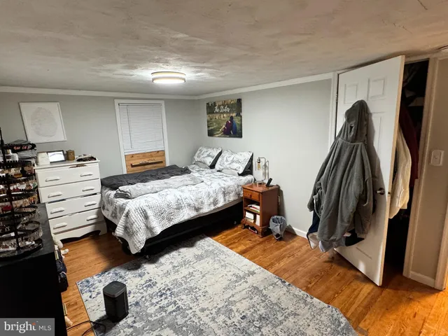 a bedroom with a bed and a walk in closet