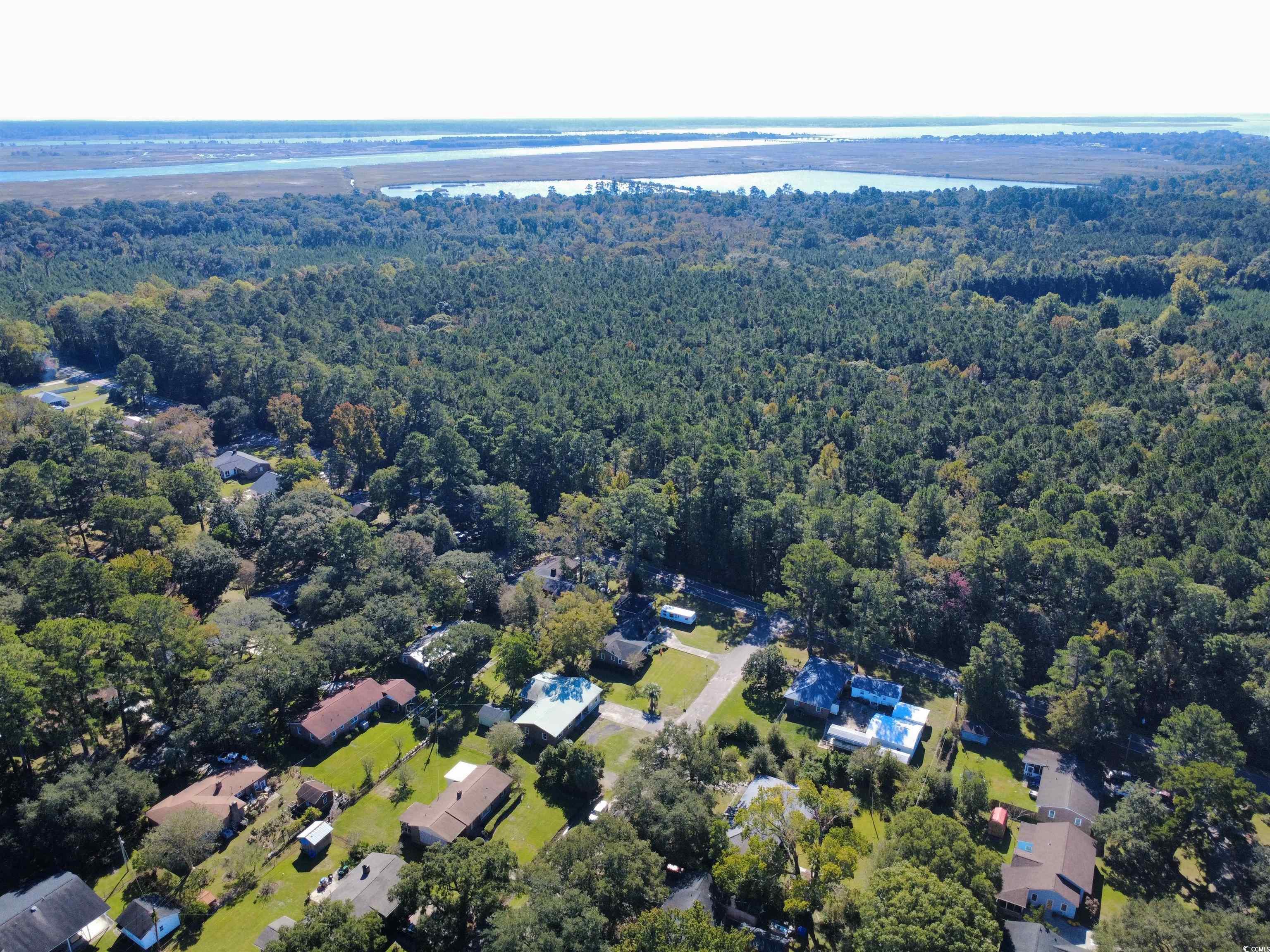 1682 Pickens Street Georgetown, SC 29440 - Photo 36 of 39 Aerial view of property and surrounding area with a nearby body of water and nearby suburban area