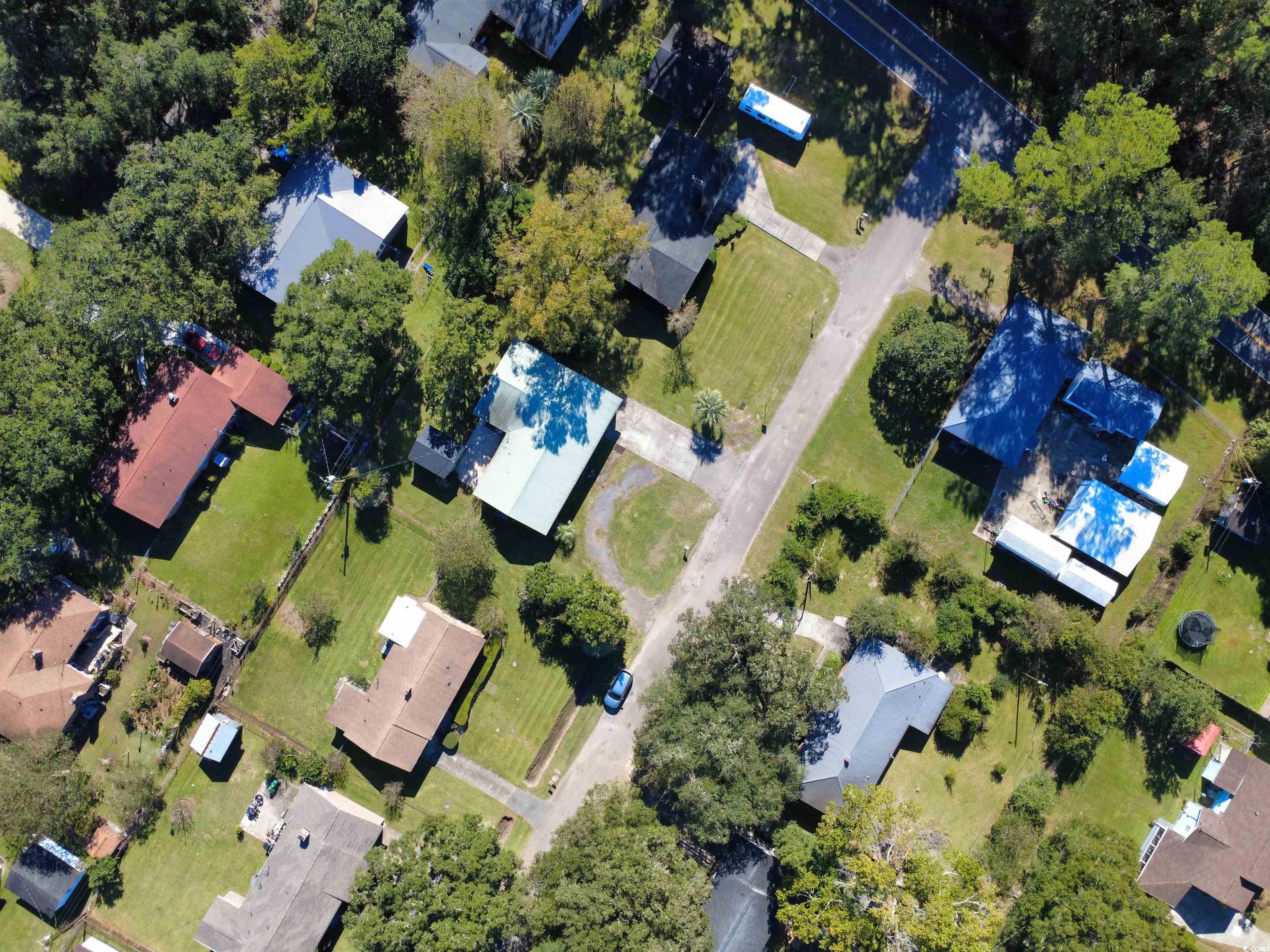 1682 Pickens Street Georgetown, SC 29440 - Photo 38 of 39 Aerial overview of property's location with nearby suburban area and a pool area