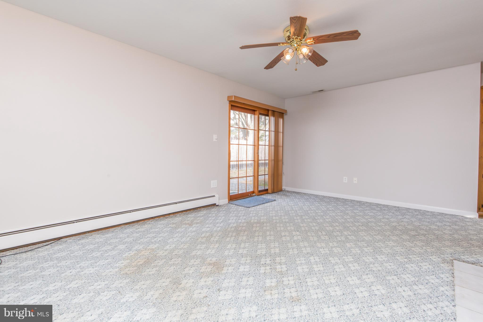 32 Balsam Road Levittown, PA 19057 - Photo 21 of 34 Living Room with Sliding Doors to Patio