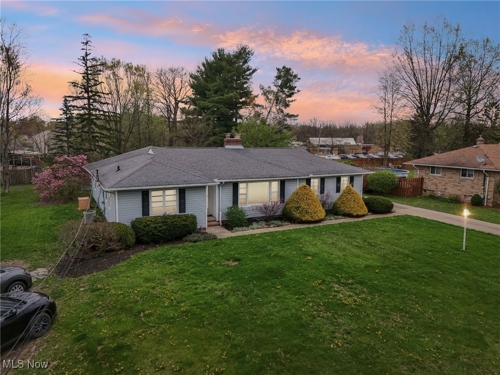 13676 Whitney Road Strongsville, OH 44136 - Photo 1 of 46 Ranch-style house with a lawn, a chimney, and fence