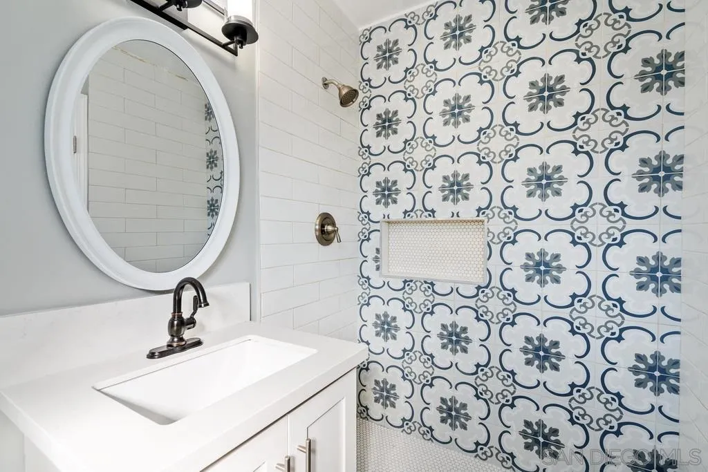 808 Leonard Avenue Oceanside, CA 92054 - Photo 11 of 25 a bathroom with a sink and a mirror