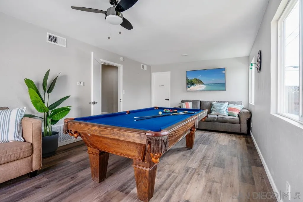 808 Leonard Avenue Oceanside, CA 92054 - Photo 12 of 25 a room with furniture pool table wooden floor and windows