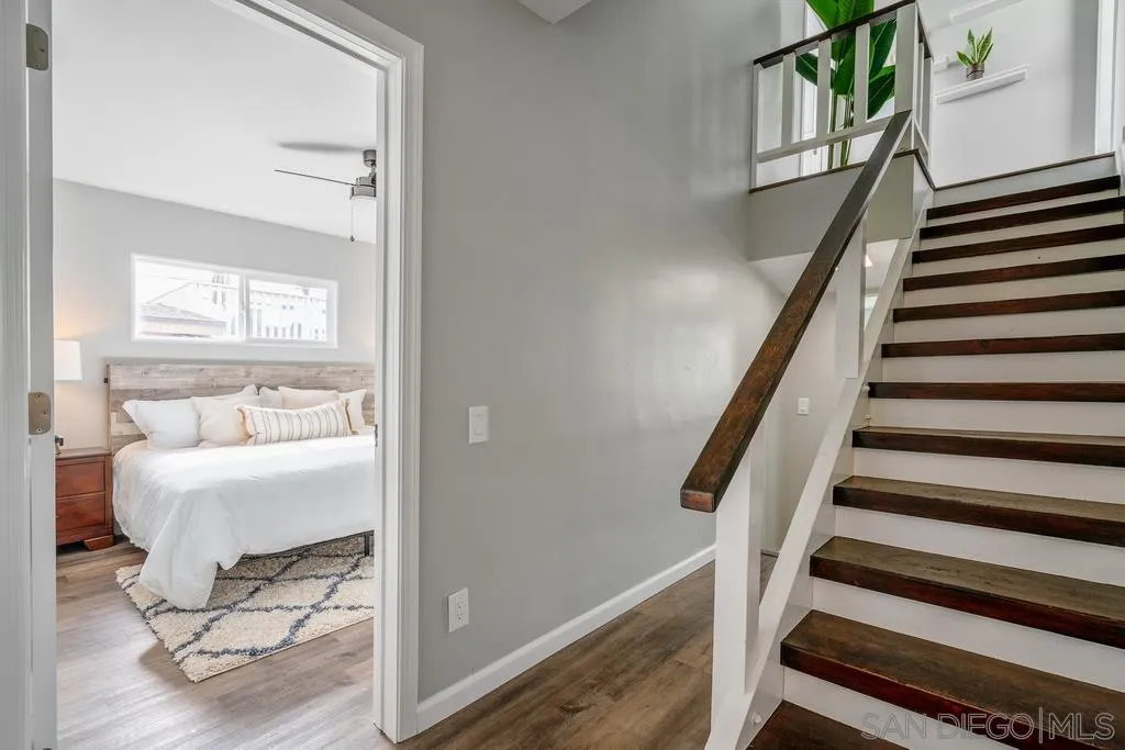 808 Leonard Avenue Oceanside, CA 92054 - Photo 16 of 25 a view of a hallway with wooden floor and staircase