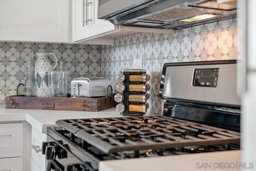808 Leonard Avenue Oceanside, CA 92054 - Photo 8 of 25 a kitchen with a stove and a cabinet