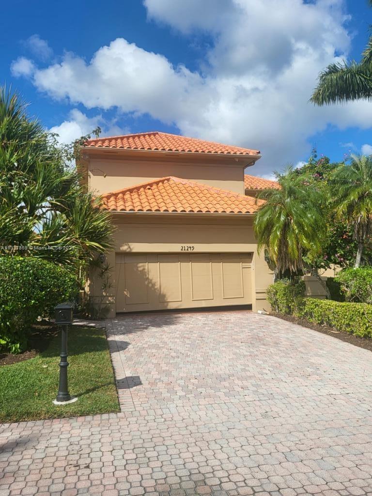 21249 Harrow Court Boca Raton, FL 33433 - Photo 1 of 18 a view of a pathway with a yard