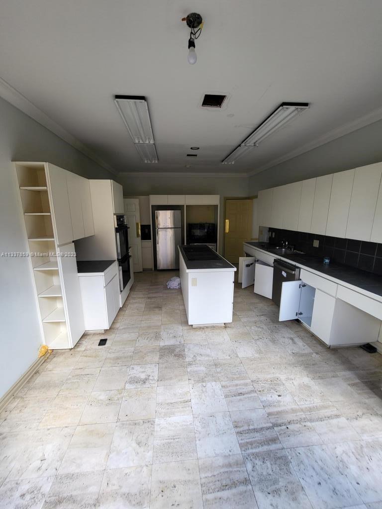 21249 Harrow Court Boca Raton, FL 33433 - Photo 14 of 18 a view of kitchen with furniture and a refrigerator