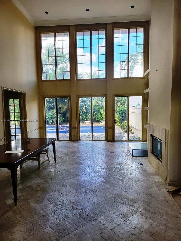 21249 Harrow Court Boca Raton, FL 33433 - Photo 5 of 18 a view of an empty room with large windows