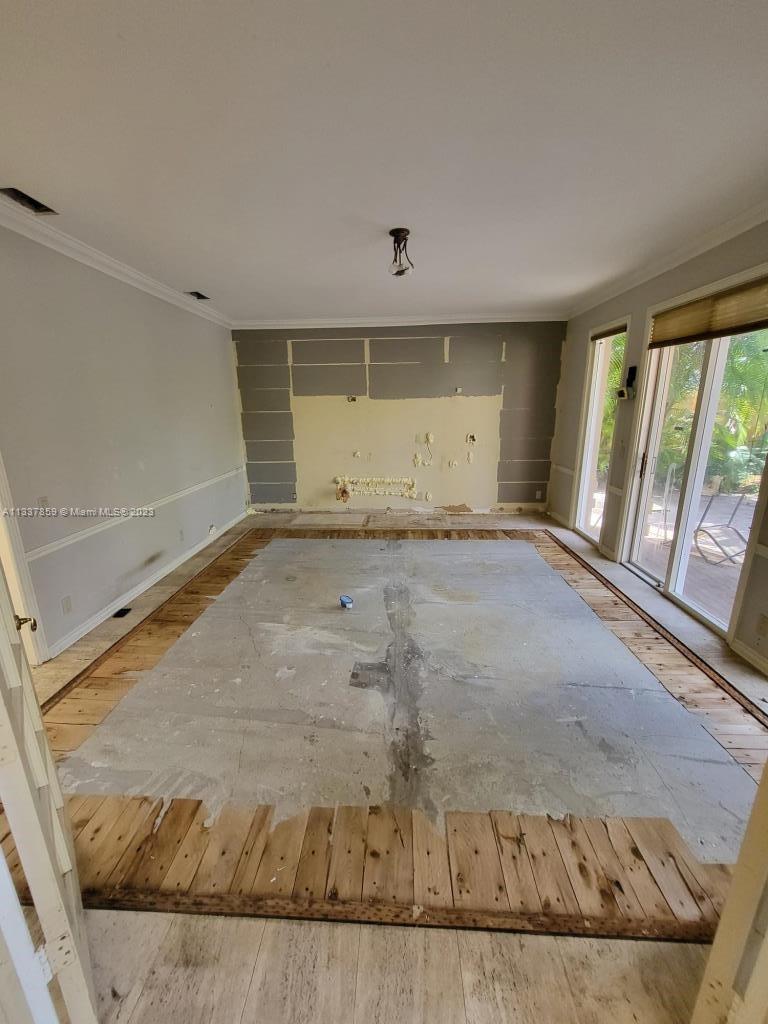 21249 Harrow Court Boca Raton, FL 33433 - Photo 8 of 18 an empty room with wooden floor and windows