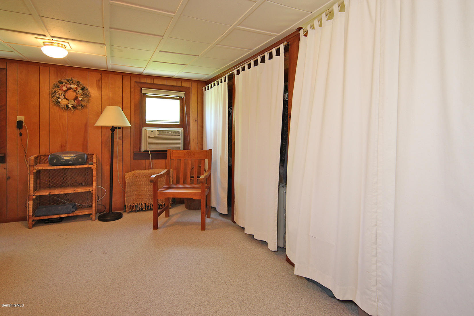 49 Main Road Tyringham, MA 01238 - Photo 14 of 32 a bedroom with furniture and a window