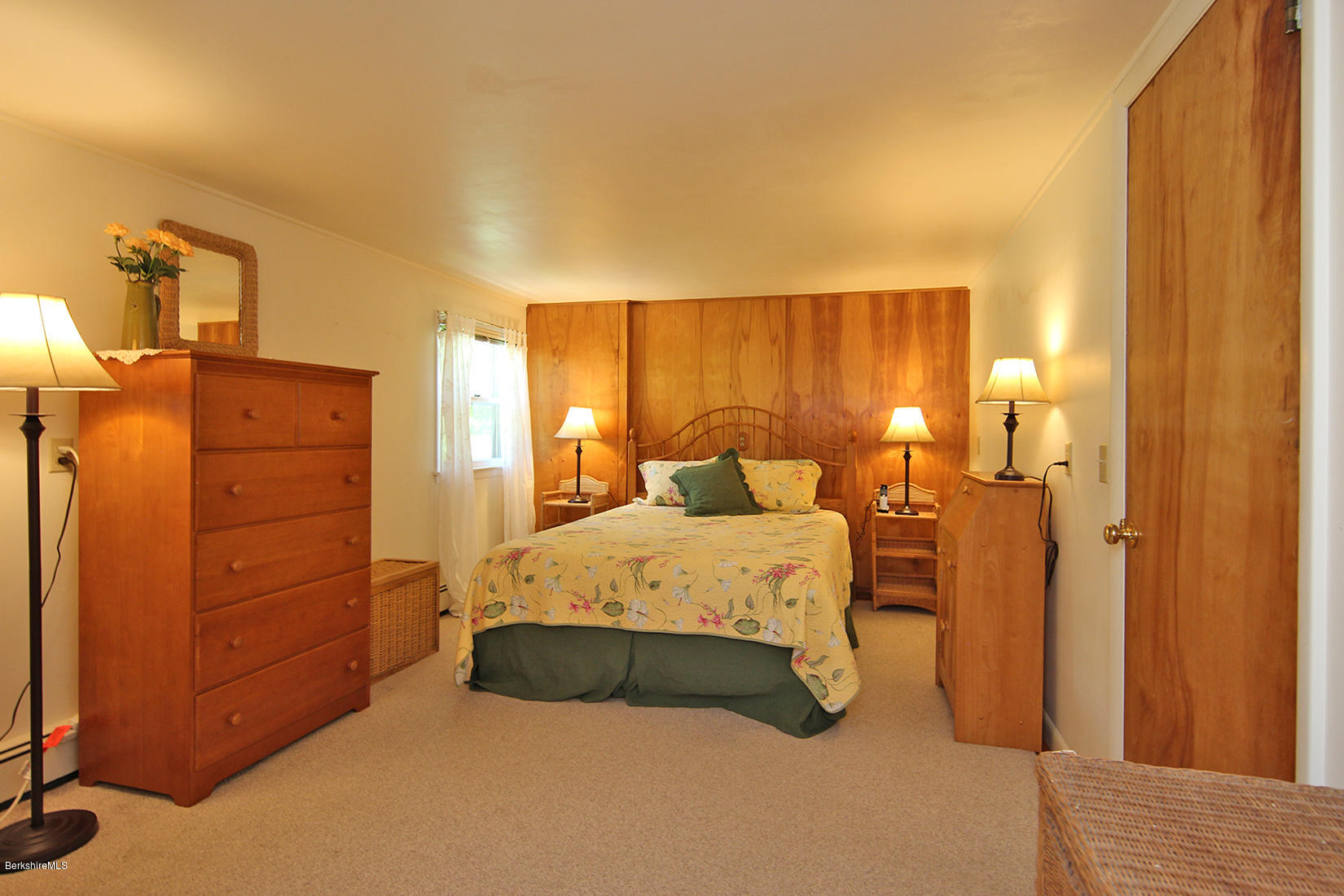 49 Main Road Tyringham, MA 01238 - Photo 22 of 32 a bedroom with a bed and cabinets