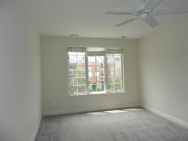 620 McHenry Road, Unit 303 Wheeling, IL 60090 - Photo 14 of 18 an empty room with a window
