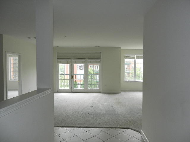 620 McHenry Road, Unit 303 Wheeling, IL 60090 - Photo 3 of 18 a view of an empty room with a window