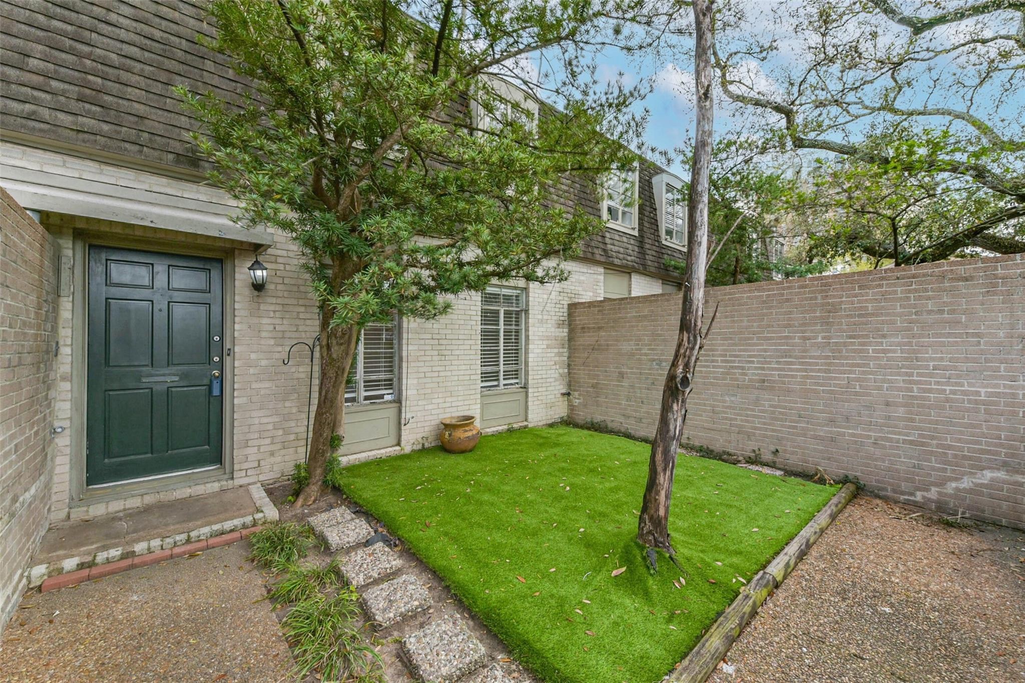 815 South Ripple Creek Drive, Unit 4 Houston, TX 77057 - Photo 1 of 12 a view of a house with backyard