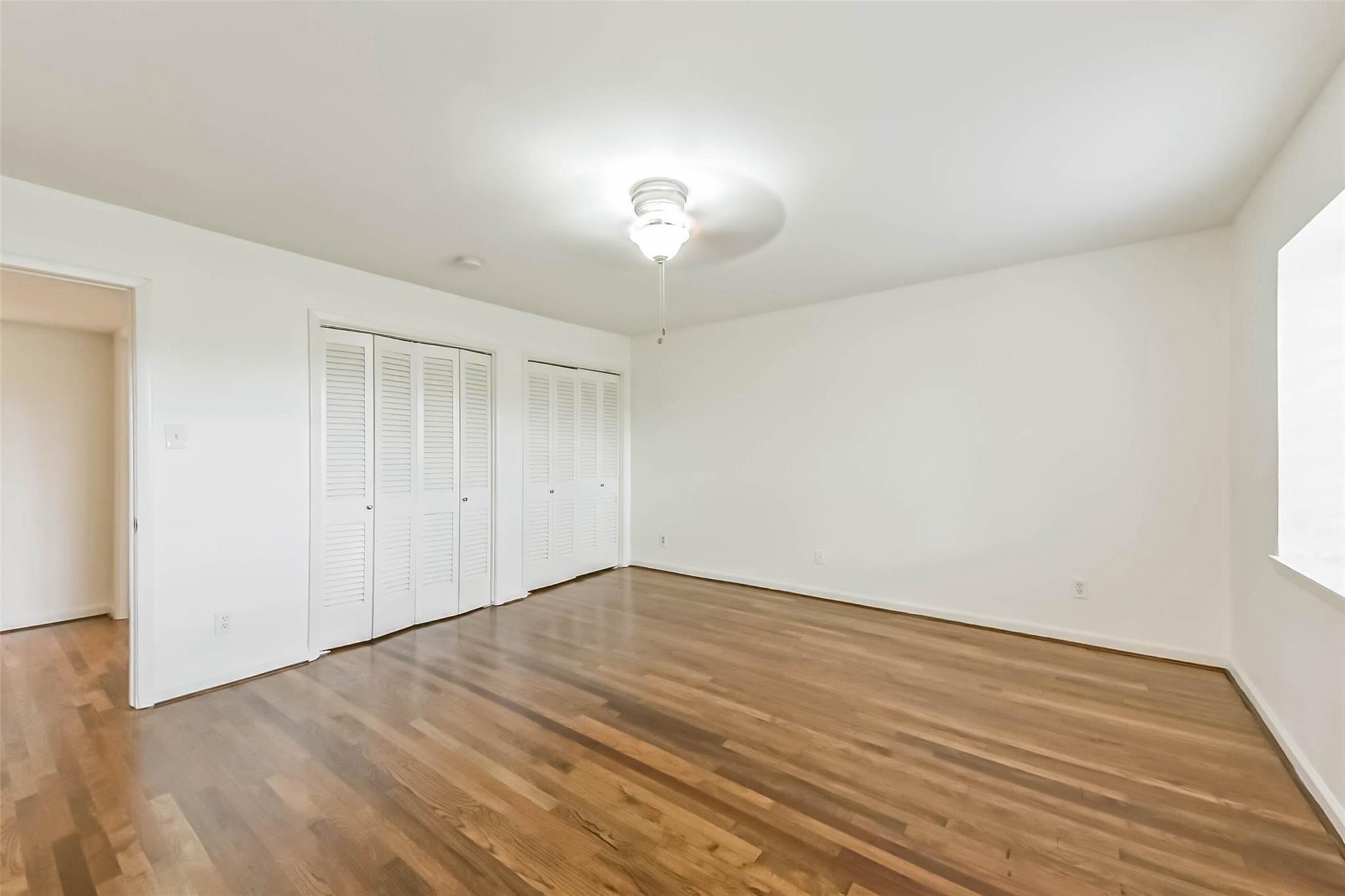 815 South Ripple Creek Drive, Unit 4 Houston, TX 77057 - Photo 6 of 12 a view of empty room with wooden floor and fan