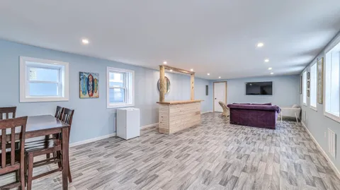 a bedroom with a bed and couch