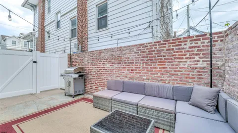 a brick building with a bench in front of it