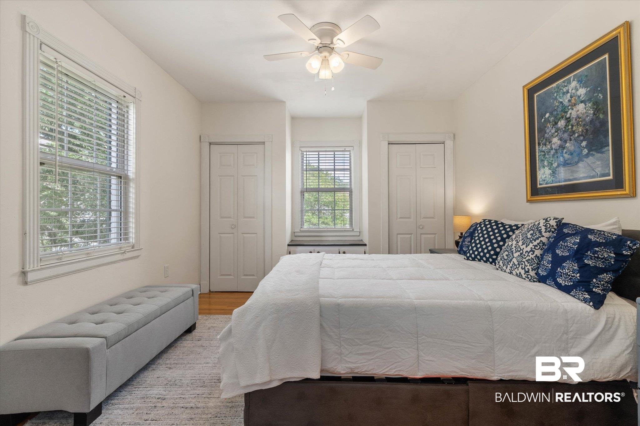 214 Upham Street, Unit 18C Mobile, AL 36607 - Photo 15 of 35 Bedroom with multiple closets, wood finished floors, and ceiling fan