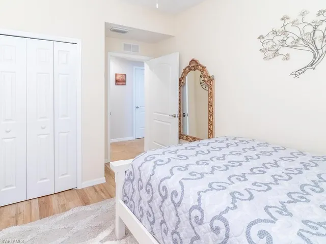 a bedroom with a bed and a dresser