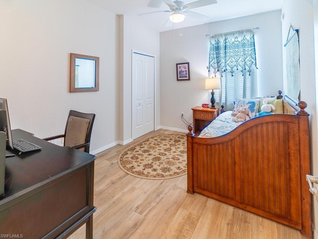 9115 Napoli Court, Unit 101 Naples, FL 34113 - Photo 21 of 49 a bedroom with bed and window