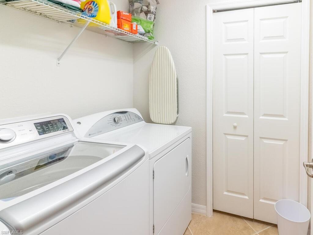 9115 Napoli Court, Unit 101 Naples, FL 34113 - Photo 23 of 49 a utility room with dryer and washer