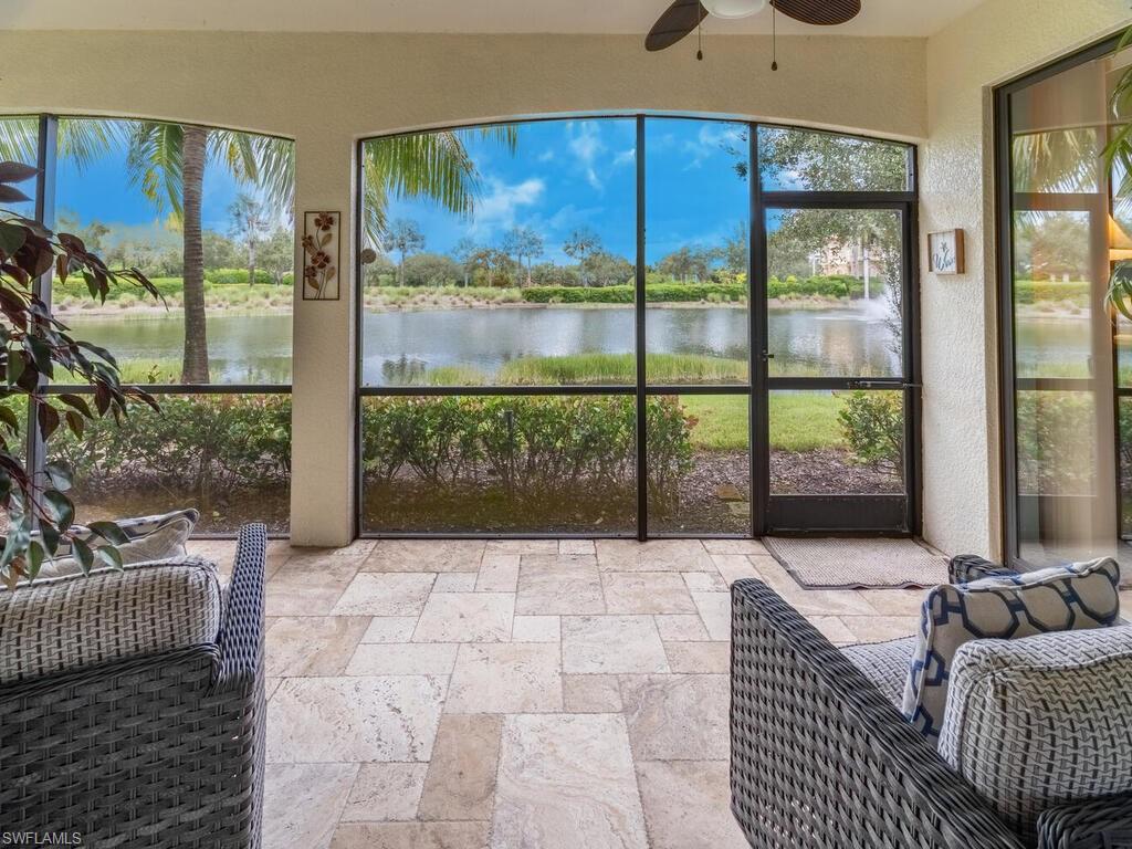 9115 Napoli Court, Unit 101 Naples, FL 34113 - Photo 25 of 49 a living room with a large window