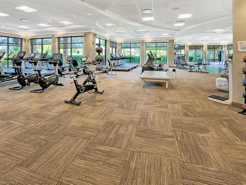 9115 Napoli Court, Unit 101 Naples, FL 34113 - Photo 39 of 49 a living room with furniture