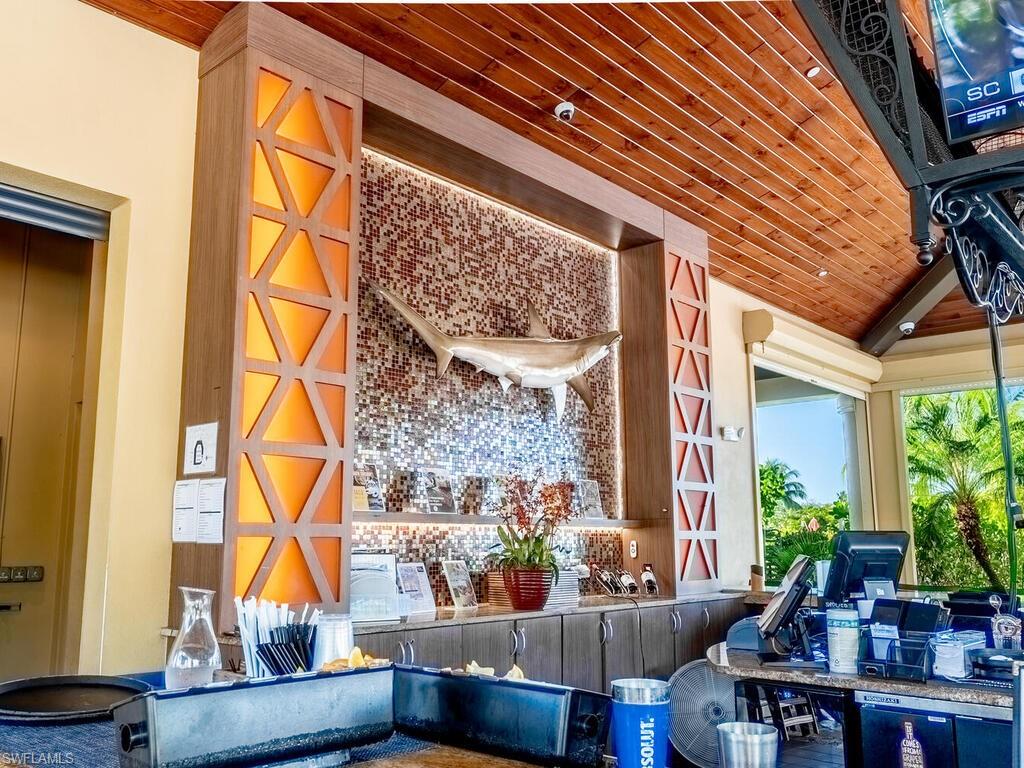 9115 Napoli Court, Unit 101 Naples, FL 34113 - Photo 41 of 49 a view of balcony with furniture and potted plants