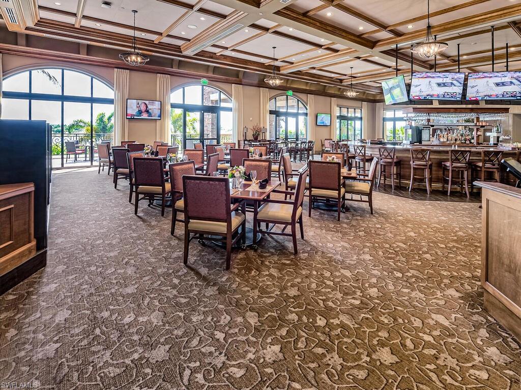 9115 Napoli Court, Unit 101 Naples, FL 34113 - Photo 47 of 49 a view of a dining room with furniture window and outside view